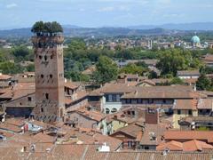 Tower of Palazzo Guinigi in Lucca with trees on the roof