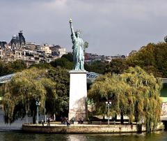 Pont de Grenelle in Paris with a statue of Liberty and weeping willows