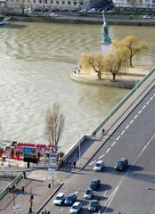 Statue of Liberty in Paris with Eiffel Tower in the background