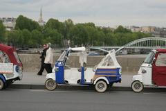 taxis on Pont d'Iéna sidewalk in Paris