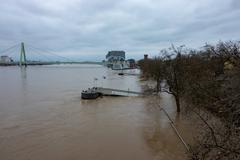 2018 floods in Cologne with submerged upper promenade, chocolate museum, and Severins Bridge