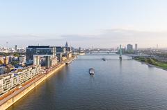 Hot air balloon ride over Cologne featuring the Rhine, Rheinauhafen with crane houses, and Severins Bridge