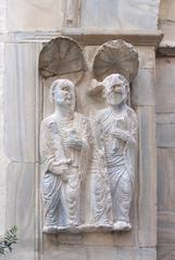 Medieval marble sculpture of two saints at the portal of Église Saint-Jean le Vieux de Perpignan