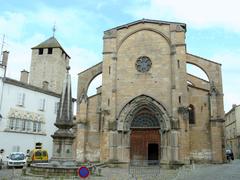 Place Notre-Dame in Cluny with Notre-Dame church, Notre-Dame fountain, a house with Gothic openwork, and Fromages tower in the background