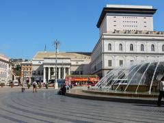 Photo of a monument part of Italy's cultural heritage in Piazza de Ferrari at night