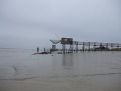 Fishing hut and Lupin fountain on the Charente estuary