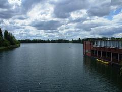 Abbey Lake in Thorpe Park surrounded by trees and greenery