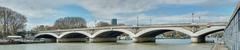 Pont d'Austerlitz in Paris on a sunny day with blue sky and clouds