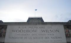 United Nations flag and Woodrow Wilson memorial plaque with Lake Geneva in the background