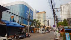 A scenic view of Chiang Mai with traditional and modern buildings surrounded by lush greenery, taken in April 2016