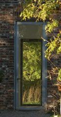 View of the Museumsinsel Hombroich with a pathway and lush greenery