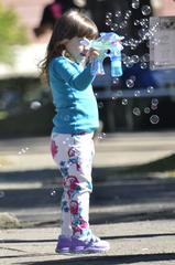 girl with soap bubble machine