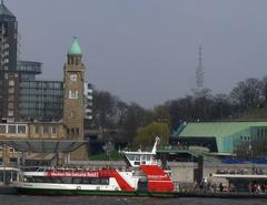 View of Hamburg's Landungsbrücken and TV tower from the river Elbe