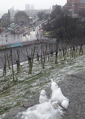 Snowman midgets at Stintfang lookout in Hamburg-St. Pauli with Hafenstraße in the background