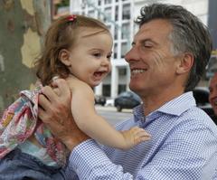 Mauricio Macri visiting Christmas Park in Buenos Aires with family and officials