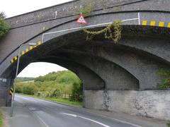 Ribbed skew arch bridge in blue brick over the A4010 road