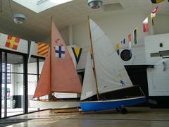 Boats of the Petite Plaisance on display in the Encan hall