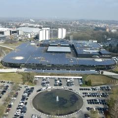 Trademart Brussels building with solar panels on the roof next to the Atomium