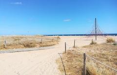 Platja de Lluminetes access between the dunes