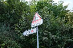 Warning! Falling Rocks sign at Bois de la Bâtie in Geneva