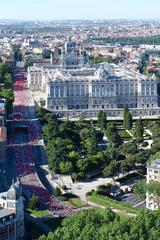 women running race near Palacio Real in Madrid, 2017