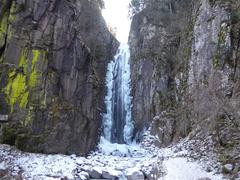 Wolf's Waterfall in winter in Bedollo, Trentino