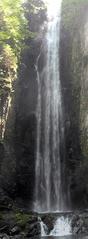 Cascata del Lupo waterfall flowing through rocks and greenery