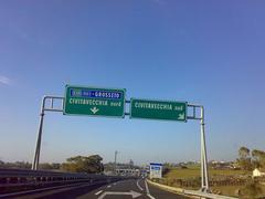 Road signs on highway A12 in Italy