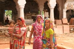 Women construction workers restoring an old monument