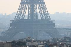 Eiffel Tower above Haussmannian buildings