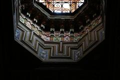 Bahia Palace courtyard with intricate tile work and lush greenery, Marrakesh