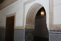 Main courtyard of Bahia Palace, Marrakech with ornate carvings and arches