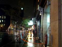 policemen and caution tape on Ste. Catherine Street in Montreal after 2012 Quebec election night shooting