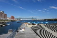 Sandy beach at Vieux Port in Ville-Marie, Montréal with people relaxing and enjoying the view