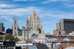 Notre-Dame Basilica and Aldred Building seen from Pointe-à-Callière Museum in Montreal