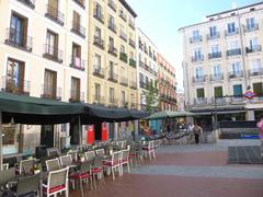 Madrid Plaza de Chueca with bustling crowds and colorful buildings