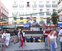 Plaza de Chueca in Madrid, Spain with people walking and buildings in the background