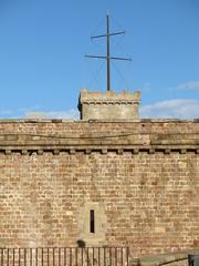 Interior view of Castell de Montjuïc with western wall and watchtower in Barcelona