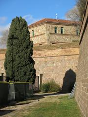 Santa Elena moat at Montjuïc Castle with historic officers' residence in the background