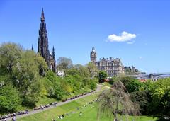 Edinburgh park with people sunbathing on a sunny day