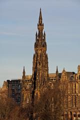 A picturesque view of Edinburgh with historic buildings and the Edinburgh Castle in the distance