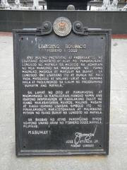 Escolta Street in Manila beside Santa Cruz Bridge with historic buildings and landmarks such as FEATI University and MacArthur Bridge.