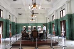 Ruang Hijau with green tile walls and antique pendulum clock