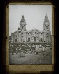 Cathedral and Plaza in Lima in 1872 with Gutierrez Hermanos suspended from the towers