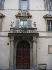 Entrance portal of Palazzo Terzi with balcony and cherubs representing autumn and winter by Giovanni Antonio Sanz