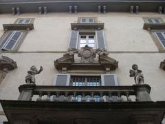 Palazzo Terzi terrace with stone-framed door and decorative cherubs