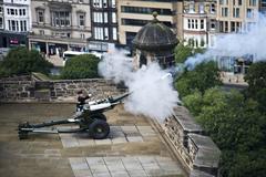 historical cannon firing at 1 o'clock with smoke