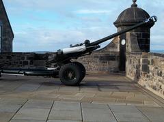 One O'clock Gun being fired outdoors with a cityscape in the background