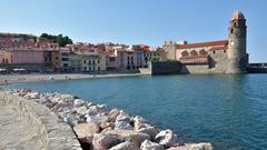 scenic view of Collioure, France, showcasing colorful buildings and boats along the harbor