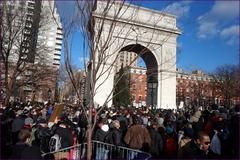 people marching with signs calling for justice for victims of police violence